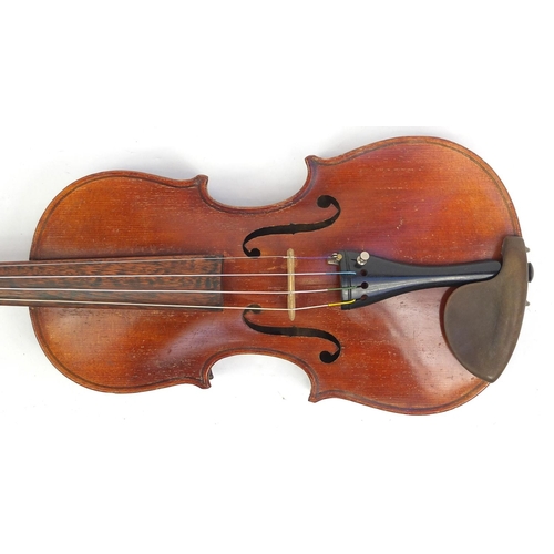 133 - Old wooden violin with scrolled neck, bow and fitted wooden carrying case, the violin bearing a Czec... 