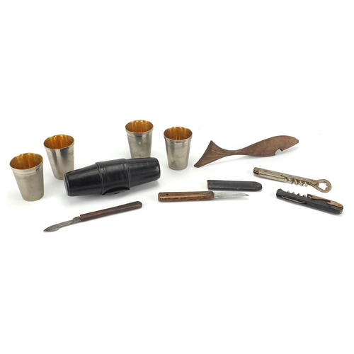 58 - Hunting and fishing objects including wooden fish bottle opener and set of four silver plated travel... 