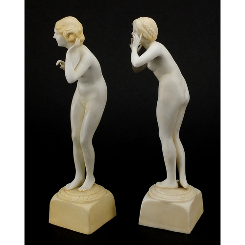 586 - Pair of Art Deco porcelain figurines, both of nude females, 
numbered to the bases, each 20.5cm high