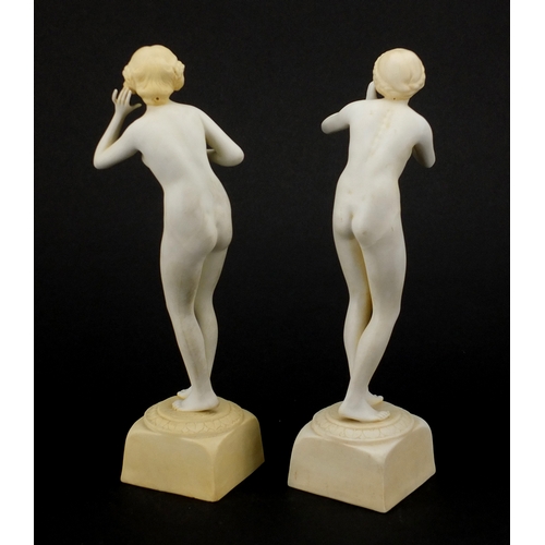 586 - Pair of Art Deco porcelain figurines, both of nude females, 
numbered to the bases, each 20.5cm high