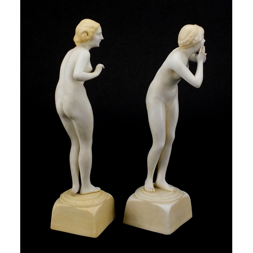 586 - Pair of Art Deco porcelain figurines, both of nude females, 
numbered to the bases, each 20.5cm high