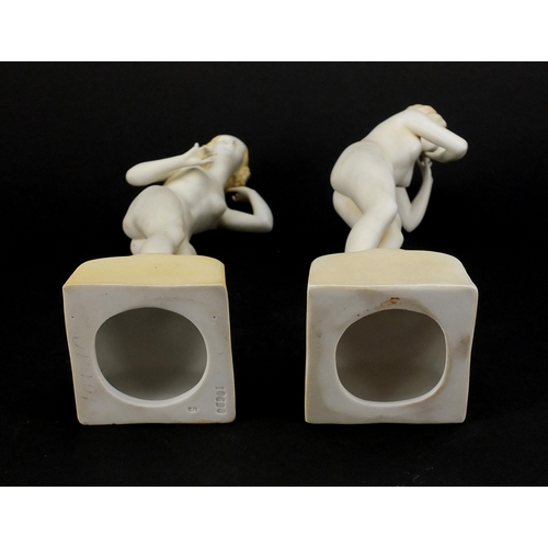 586 - Pair of Art Deco porcelain figurines, both of nude females, 
numbered to the bases, each 20.5cm high