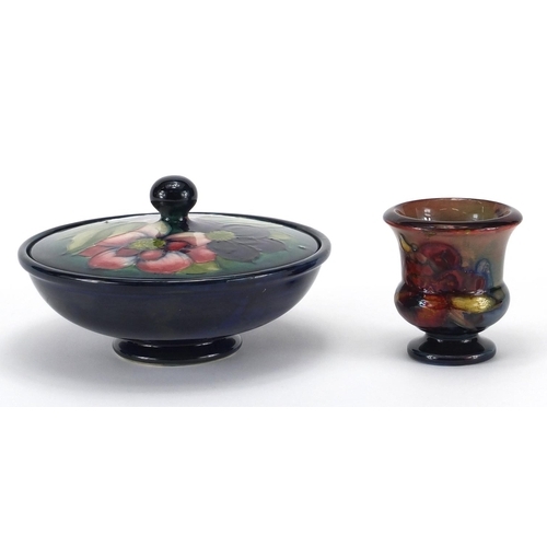 561 - Moorcroft pottery Hibiscus powder bowl and cover, together with a Moorcroft pottery Flambe urn vase,... 