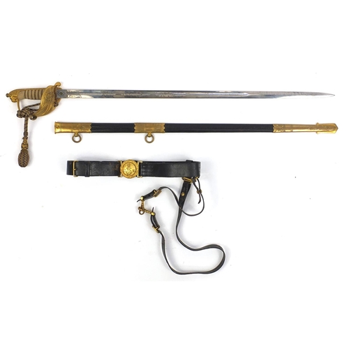 289 - British Military World War II Naval dress sword by Moss Bro's of Cambridge Circus, with belt and han... 
