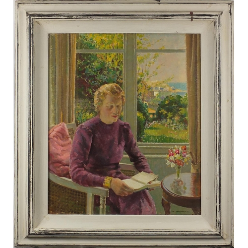 1065 - Arthur Hayward - Female in an interior before St Ives harbour, oil on canvas, inscribed verso, frame... 