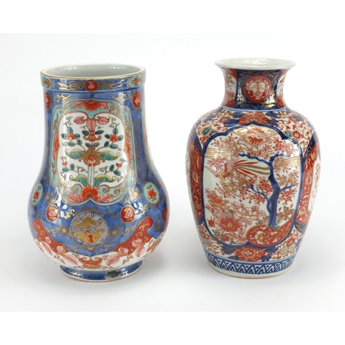 389 - Two Japanese Imari porcelain vases including one finely hand painted and gilded with panels of flowe... 