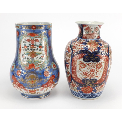 389 - Two Japanese Imari porcelain vases including one finely hand painted and gilded with panels of flowe... 