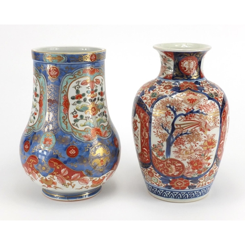 389 - Two Japanese Imari porcelain vases including one finely hand painted and gilded with panels of flowe... 