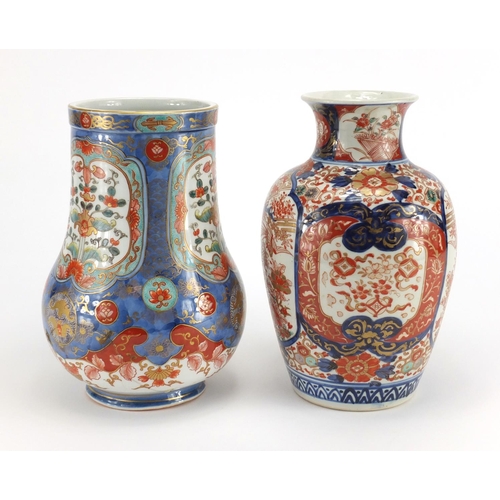 389 - Two Japanese Imari porcelain vases including one finely hand painted and gilded with panels of flowe... 