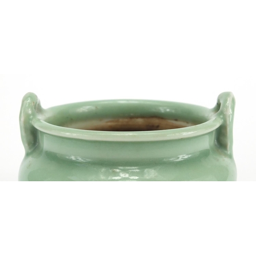 381 - Chinese celadon glazed tripod incense burner with twin handles, 8.5cm high x 12cm in diameter