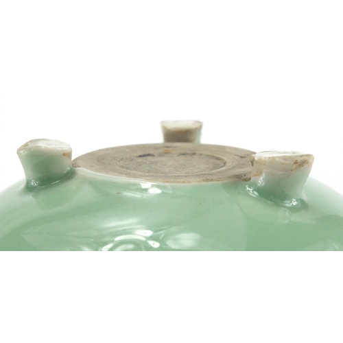 381 - Chinese celadon glazed tripod incense burner with twin handles, 8.5cm high x 12cm in diameter