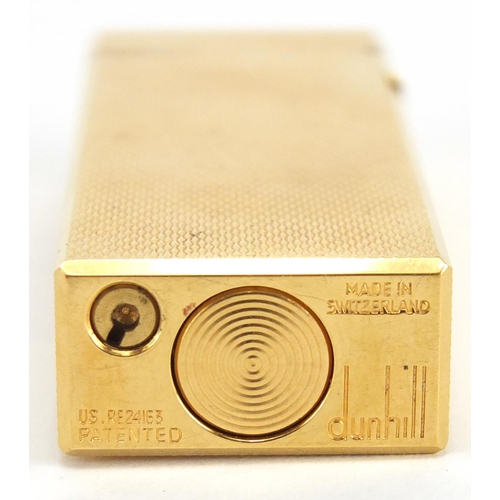 81 - Gold plated Dunhill pocket lighter and cheroot with gold coloured metal mount, both with fitted case... 