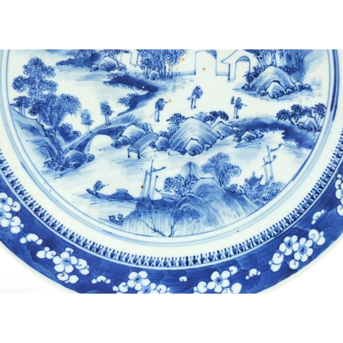 373 - Chinese blue and white porcelain charger, hand painted with figures in a river landscape, 41cm in di... 