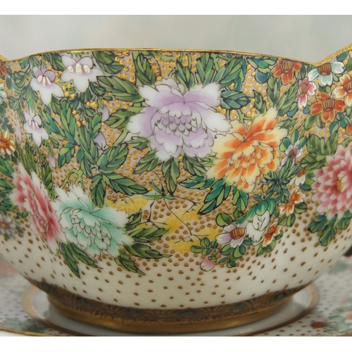 390 - Japanese porcelain cup and saucer, finely hand painted with flowers and butterflies, six figure char... 