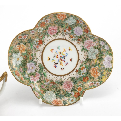 390 - Japanese porcelain cup and saucer, finely hand painted with flowers and butterflies, six figure char... 