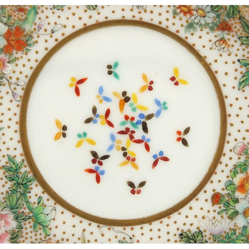 390 - Japanese porcelain cup and saucer, finely hand painted with flowers and butterflies, six figure char... 