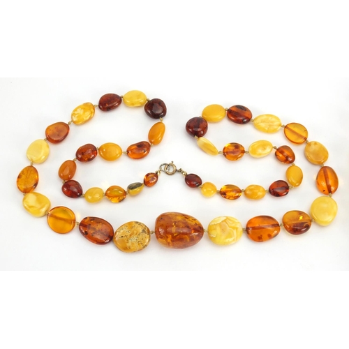 781 - Two butterscotch amber coloured bead necklaces, the largest 70cm in length,  approximate weight 111.... 