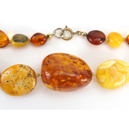 781 - Two butterscotch amber coloured bead necklaces, the largest 70cm in length,  approximate weight 111.... 