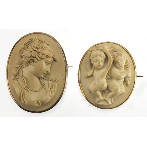 749 - Two lava brooches, maidens head and cherubs, both with gold coloured metal mounts, the largest 4cm i... 