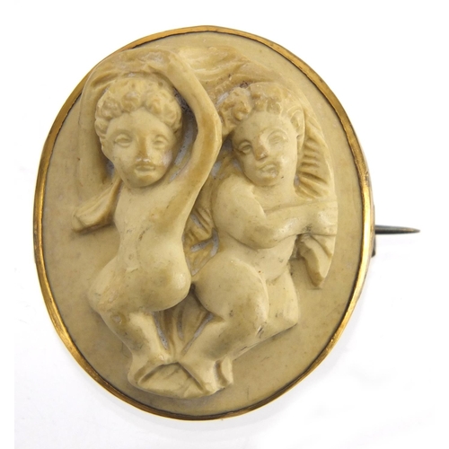 749 - Two lava brooches, maidens head and cherubs, both with gold coloured metal mounts, the largest 4cm i... 