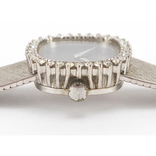 821 - Ladies 18ct white gold Bucherer wristwatch, with diamond surround, approximate weight 43.1g