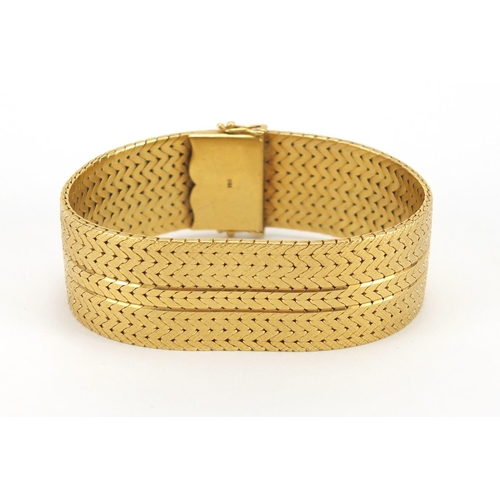 678 - Heavy 18ct gold wide herringbone link bracelet, 19cm in length x 2.2cm wide, approximate weight 104.... 