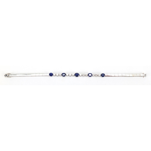 676 - 18ct white gold graduated Sapphire and Diamond bracelet, 18cm in length, approximate weight 13.9g