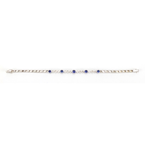 676 - 18ct white gold graduated Sapphire and Diamond bracelet, 18cm in length, approximate weight 13.9g