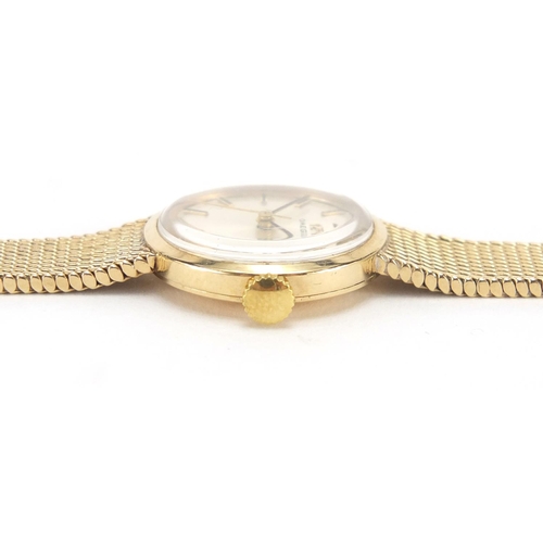 824 - Ladies 9ct gold Omega wristwatch with 9ct gold strap, 2.1cm in diameter, approximate weight 24.4g