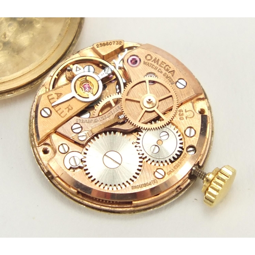 824 - Ladies 9ct gold Omega wristwatch with 9ct gold strap, 2.1cm in diameter, approximate weight 24.4g