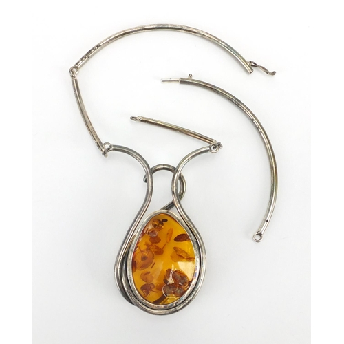 796 - Large unmarked silver and natural amber necklace, the amber 6cm in length, approximate weight 82.4g