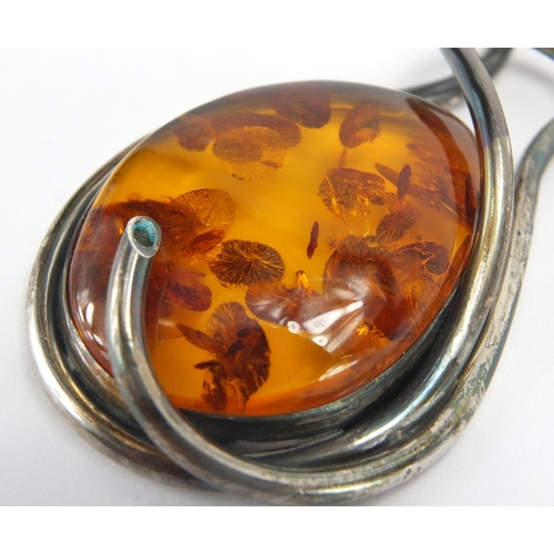 796 - Large unmarked silver and natural amber necklace, the amber 6cm in length, approximate weight 82.4g