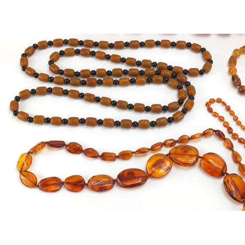 782 - Seven natural and butterscotch amber coloured bead necklaces, the largest 140cm in length, approxima... 