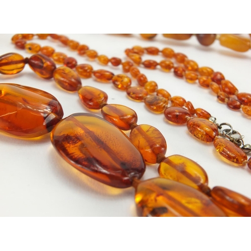 782 - Seven natural and butterscotch amber coloured bead necklaces, the largest 140cm in length, approxima... 