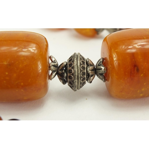 782 - Seven natural and butterscotch amber coloured bead necklaces, the largest 140cm in length, approxima... 