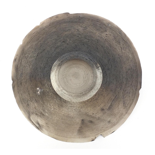 588 - David Howard Jones Raku bowl with flared rim, incised initials around the foot rim, 20cm in diameter