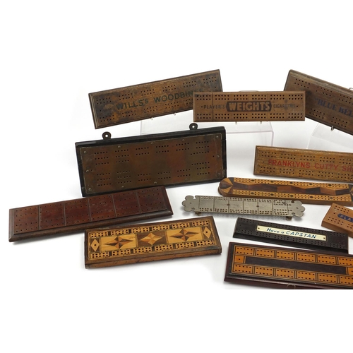 329 - Vintage and later cribbage boards including inlaid Bakelite and advertising examples, the largest 36... 