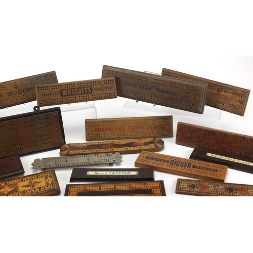 329 - Vintage and later cribbage boards including inlaid Bakelite and advertising examples, the largest 36... 