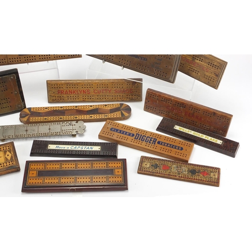 329 - Vintage and later cribbage boards including inlaid Bakelite and advertising examples, the largest 36... 