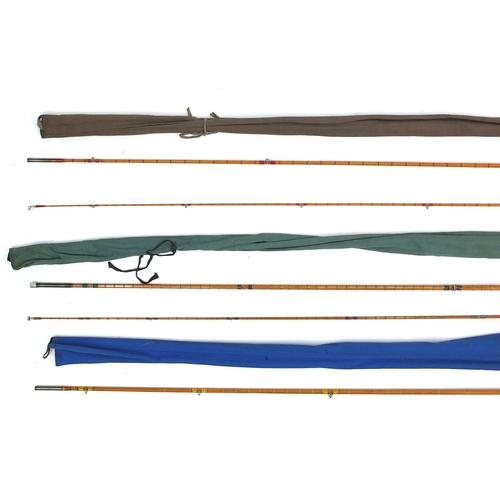 158 - Seven split cane fishing rods including two Hardy Bros Fibalite Spinning, each with canvas bags