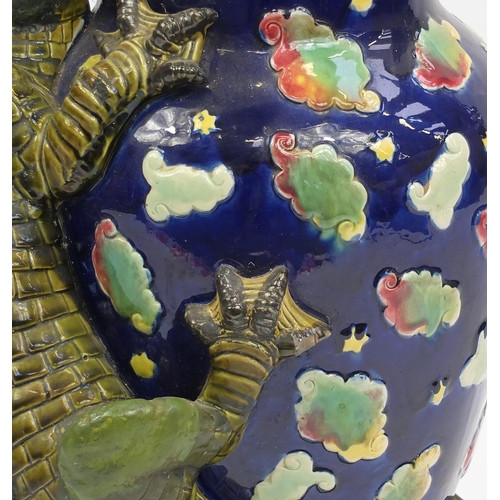 575 - Large George Jones Majolica vase, decorated in relief with a dragon, hand painted with clouds, numbe... 