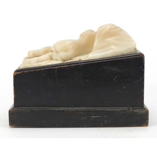 9 - Classical white marble carving of a sleeping nude boy, raising on an ebonised base, 15cm H x 19cm W ... 