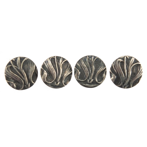 618 - Set of four Art Nouveau silver buttons, each 2.3cm in diameter, approximate weight 15.8g