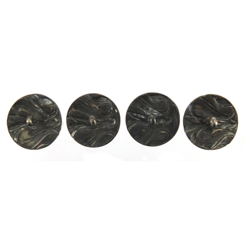 618 - Set of four Art Nouveau silver buttons, each 2.3cm in diameter, approximate weight 15.8g