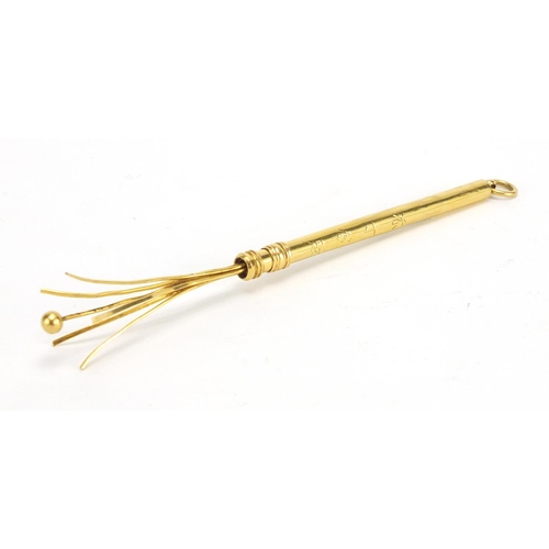 414 - Chinese 22k gold swizzle stick with character marks, impressed 22k, 8.5cm in length when closed, app... 