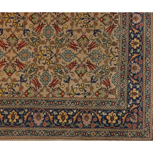 2005 - Rectangular Indian rug having and repeat flower head and vine design, approximately 290cm x 208cm