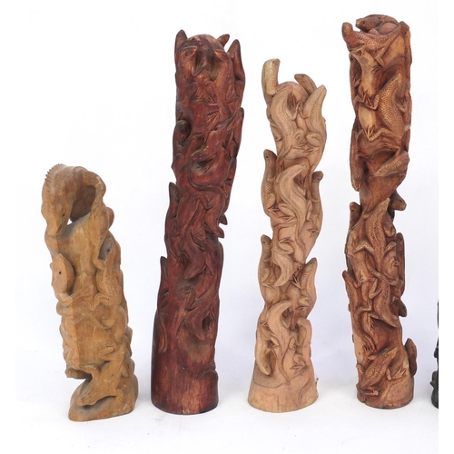 459 - Five carved wood lizard groups, the largest 68cm high