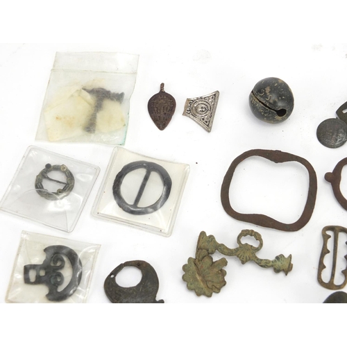 629 - Large selection of metal detecting finds including belt buckles