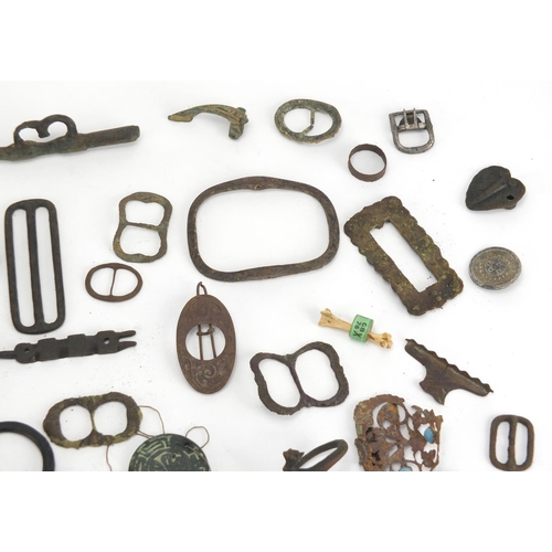 629 - Large selection of metal detecting finds including belt buckles