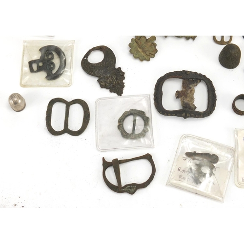 629 - Large selection of metal detecting finds including belt buckles